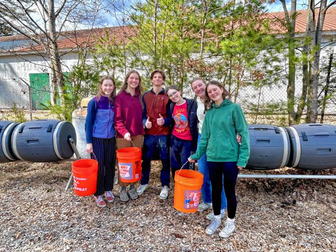 From left to right: Flo Dapice, Amelia Walsh, Merrick Chapin and Evie Hopper, Izzy Afflerbach and Rose Afflerbach with buckets filled with food scraps at the Hopkinton High Middle School