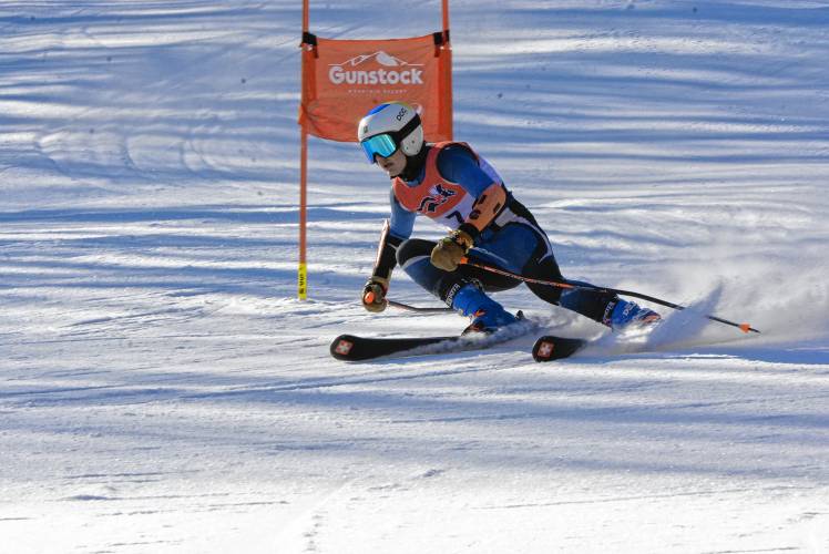 John Stark’s Austin Freeman competes in the giant slalom at the NHIAA Division III Alpine ski championship at Gunstock on Thursday. Freeman finished third in the slalom and fourth in the GS.