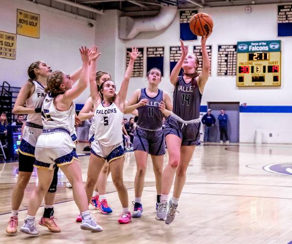 Merrimack Valley forward Kayla Smith shoots around a group of players during the Pride's D-II first round matchup against Bow on Wednesday, February 28, 2024.