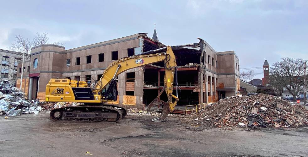 The demolition of the former Department of Justice building off of Capitol Street is coming along on Thursday. The area will become a parking garage for the State House once it is completed.