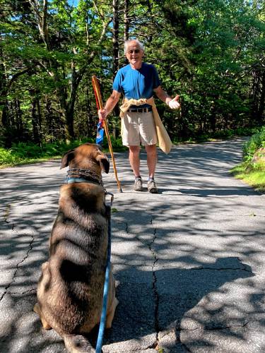 John Burke of Peterborough was joined on some of his hikes up Pack Monadnock by his daughter, Lynsey, and her dog, Berlioz.