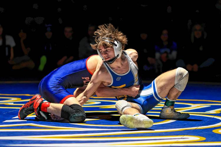 Bow’s Adler Moura (right) breaks free and attempts a move against Plymouth’s Anthony Torres in the 113-pound finals at the Division III wrestling championship at Bow High School on Saturday. Moura won his third D-III title and was named the tournament’s Outstanding Wrestler.