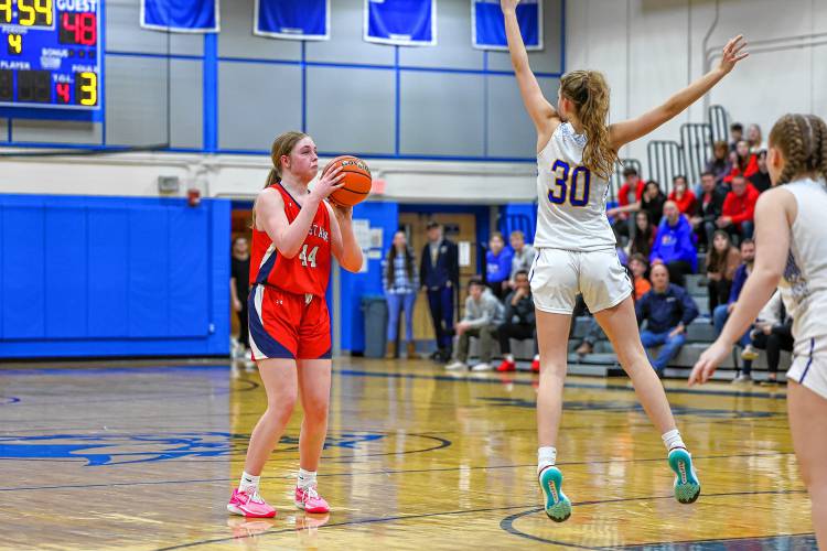 Eleanor Girardet lines up a 3-pointer as Concord Christian’s Emma Smith leaps in front of her during the Division II semifinal on Wednesday at Salem High School.