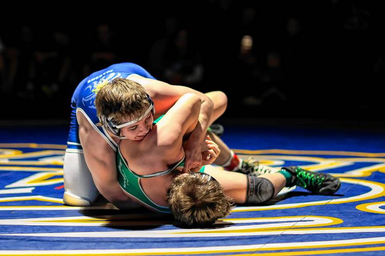 Bow’s Jackson Hall attempts to pin Monadnock’s Seth Adams in the 215-pound final at the Division III wrestling championship at Bow High School on Saturday. Hall won the match in a 7-5 decision to claim the 215 crown.
