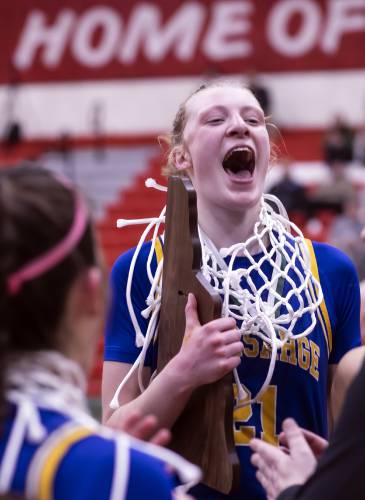 Kearsarge Tessa Marinello holds the D-III Championship trophy after the Cougars defeated Hopkinton on Saturday night, February 24, 2024 at Keene State College.