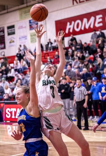 Hopkinton guard Shaylee Murdough (3) goes up for a shot against Kearsarge forwward Adara Boucher during the first half of the D-III Championship at Keene State College on Saturday night, February 24, 2024.