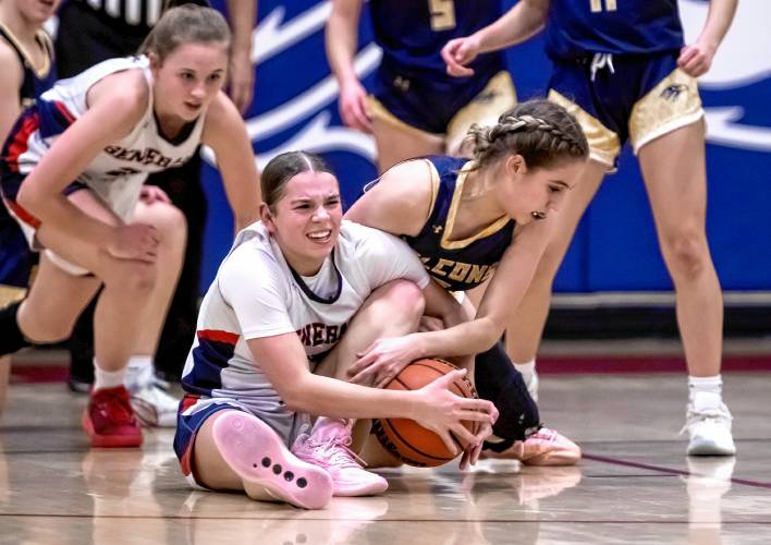 FILE – John Stark guard Abby Duclos (center) battles with Bow guard Juliette Tarsa on the floor during the first half of a game on Jan. 25. 