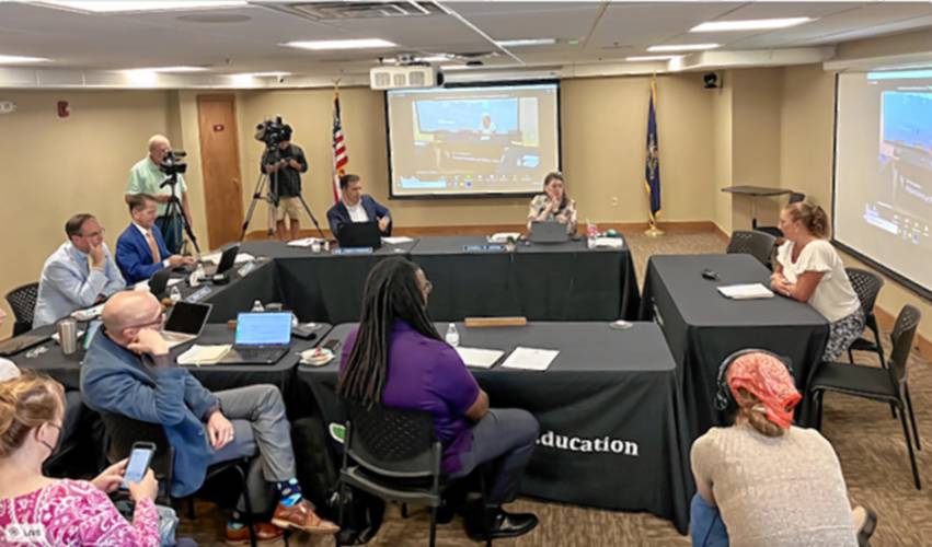 National Education Association of New Hampshire President Megan Tuttle (right) testifies to the State Board of Education against the approval of a financial literacy program from PragerU in 2023.