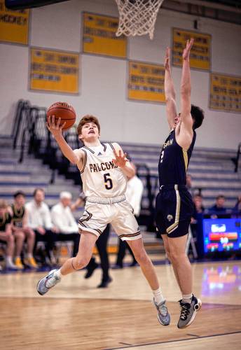 Bow guard Colby Smith goes up for a layup against Souhegan on Tuesday night, February 27, 2024. Smith led the Falcons with 19 points in their first round win.