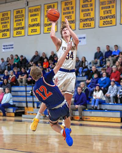 Bow’s Jake Reardon goes up for a shot against Plymouth during a game at Bow High School on Thursday. Reardon led the Falcons with 17 points in a 57-56 loss. 