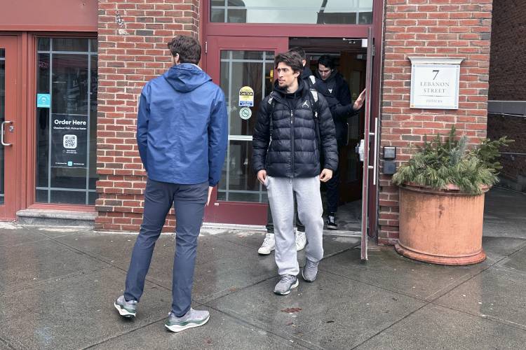 Dartmouth basketball players, including Cade Haskins, left, and Romeo Myrthil leave after voting in Hanover, N.H., Tuesday, March 5, 2024. Dartmouth basketball players vote Tuesday on whether to form a union.(AP Photo/Jimmy Golen)