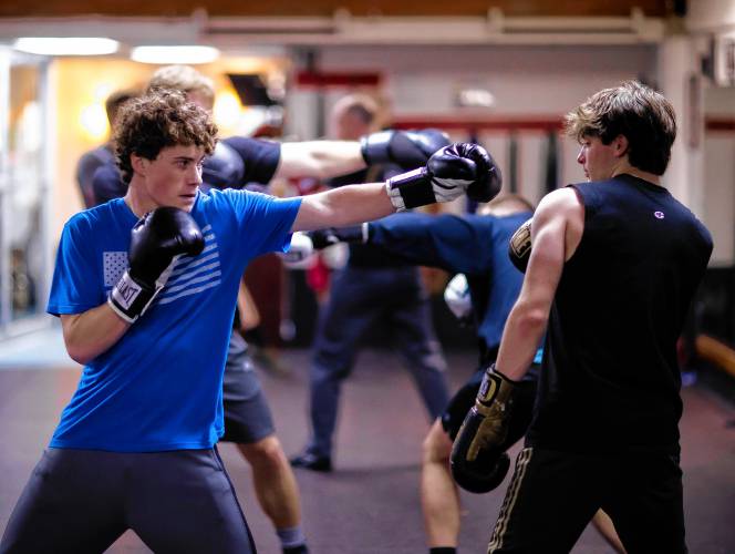 Ritchie Philbrick boxes with his brother Ronnie during their boxing class at Averill's Boxing in downtown Concord on March 7, 2024.