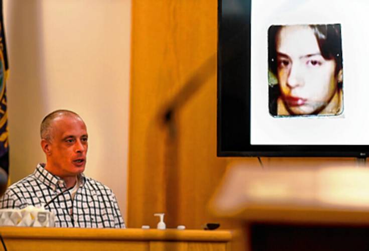 Plaintiff David Meehan testifies as his YDC intake photo at age 14 is displayed on a screen during his civil trial at Rockingham County Superior Court in Brentwood on April 17, 2024.