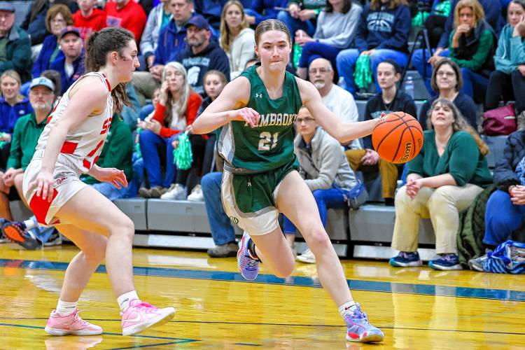 Annelise Dexter dribbles toward the basket for Pembroke during the D-II semifinal against Laconia on March 6.