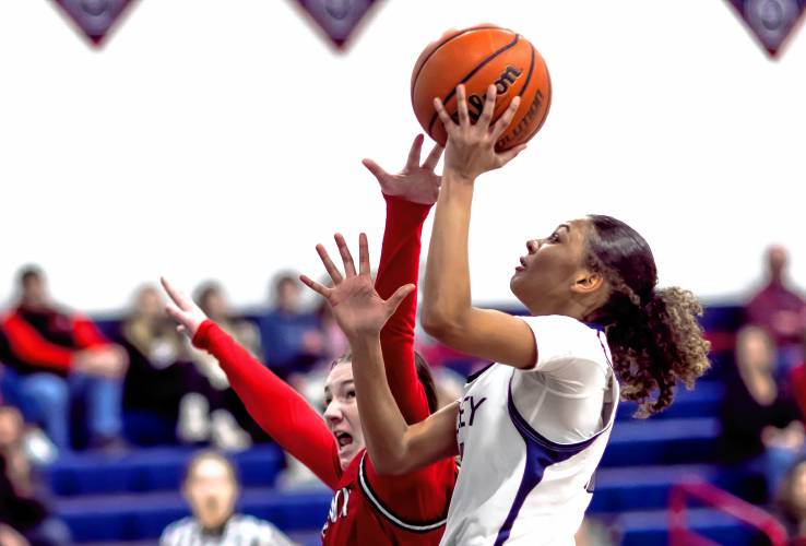 Merrimack Valley forward Jada Lucas (right) scores on a layup as Coe-Brown forward Zoey Smith defends during the first half on Tuesday, December 19, 2023.