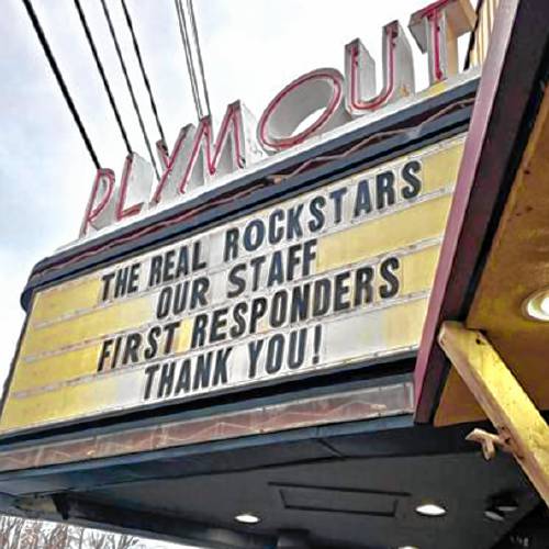 The marquee in front of the Flying Monkey theater in Plymouth pays tribute to those who evacuated the building when a fire broke out in a neighboring building last weekend, and those who contained the fire.