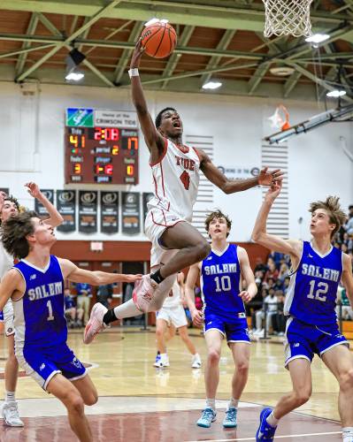Concord's Alain Twite throws down a dunk during a game against Salem at Concord High School on Tuesday, Feb. 20, 2024. Twite scored 21 points to lead Concord to an 84-58 victory. CHIP GRIFFIN / Photos By Chip