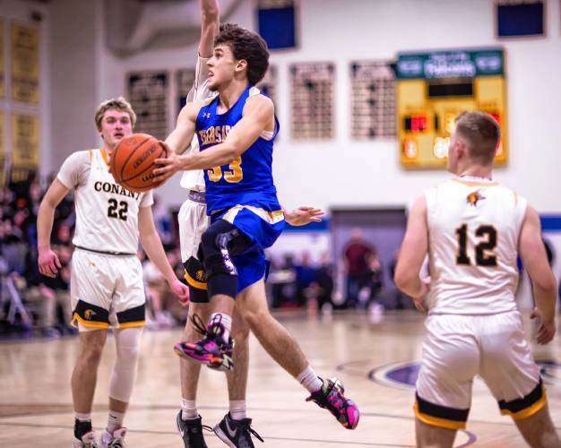 Kearsarge guard Noah Whipple drives to the hoop against Conant to begin the second half on Tuesday night at Bow High School during the Division III semifinals.