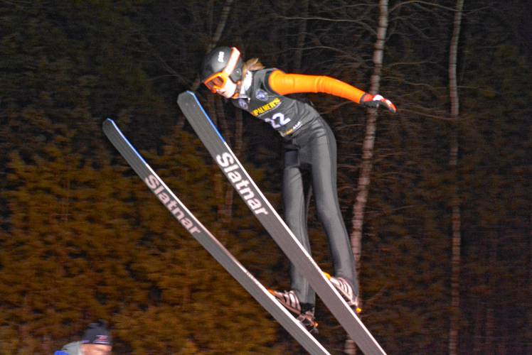 Concord's Sebastian Christie flies through the air at the NHIAA ski jumping state championship at Chip Henry Ski Jump in Conway on Thursday, Feb. 15, 2024. Christie finished 12th in the state. JOSHUA SPAULDING / Salmon Press