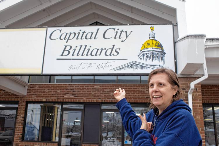 Kathy Miller and her partner, Jeff Burnham are converting a former fitness facility to the Capital City Billiards in the Fisherville Road plaza. The pool business will feature 14 new Brunswick tables, each nine feet long, plus darts, a small kitchen and a full bar.