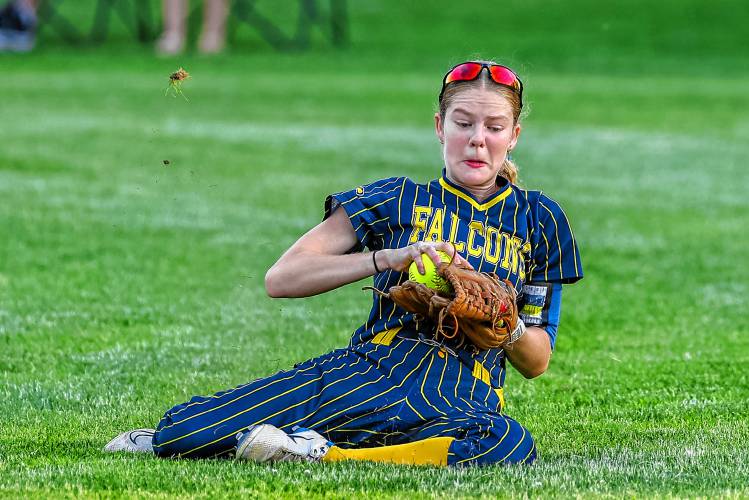Bow center fielder Reis Domini slides to make a catch during the D-II softball semifinal against Coe-Brown on Tuesday, June 4, 2024. The Falcons lost, 4-0.