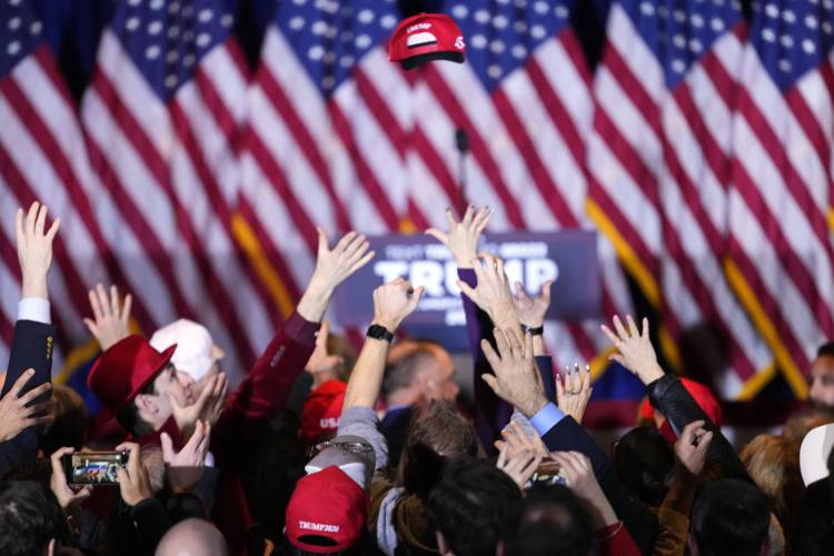 Supporters cheer after learning that Republican presidential candidate former President Donald Trump has won the New Hampshire primary,at a primary election night party in Nashua, N.H., Tuesday, Jan. 23, 2024. (AP Photo/Pablo Martinez Monsivais)