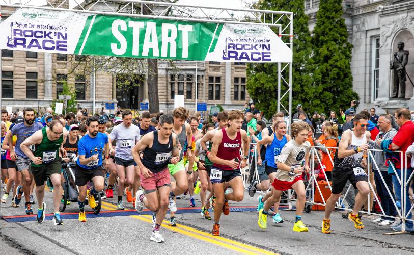 The first wave of runners start the 22nd Annual Rock ’N Race on North State Street in back of the State House on Wednesday.