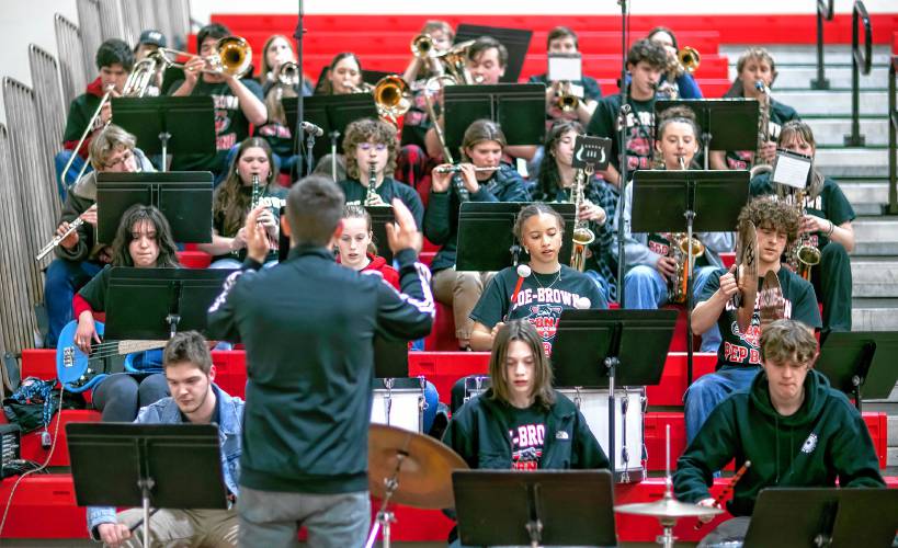 The Coe-Brown Northwood Academy pep band, led by Jon Ludwig (foreground left), plays during Tuesday night’s Division II boys’ basketball game between Coe-Brown and Pelham in Northwood.