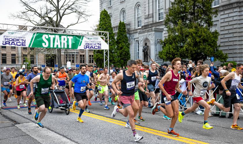 The first wave of runners start the 22nd Annual Rock’ N Race on North State Street in back of the State House on Wednesday evening, May 8, 2024.