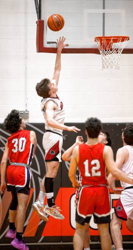 Coe-Brown forward Connor Bagnell goes up for a tip in against John Stark on Tuesday night, February 6, 2024.