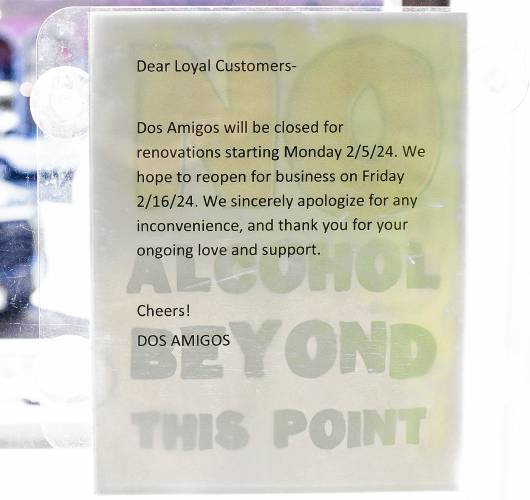 A sign inside Dos Amigos on Main Street in downtown Concord saying they hope to have the store back open by next week after working on major renovations to the restaurant.