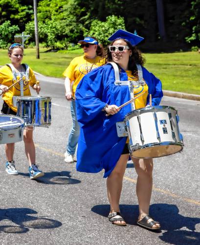 Franklin graduate Olivia Sylvester plays the drums in the parade down Main Street on Thursday, June 13 2024.