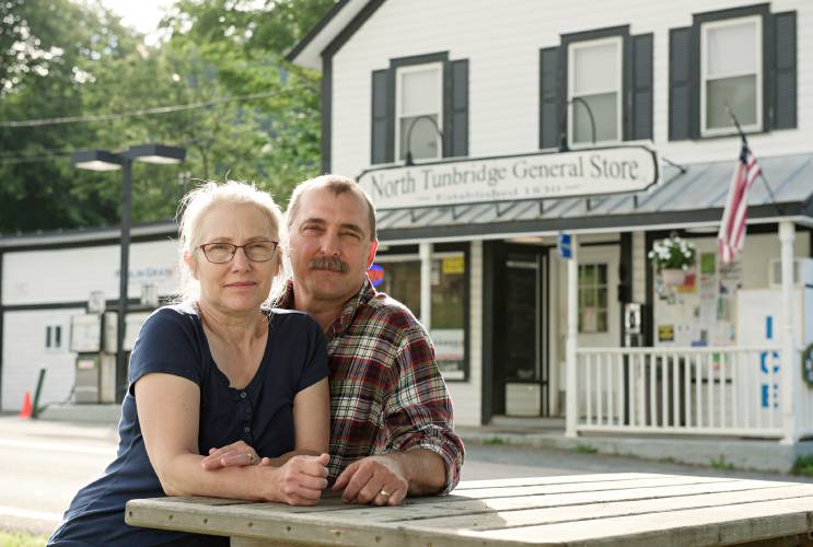 Lois and Michael Gross, owners of the North Tunbridge General Store, photographed in Tunbridge, Vt., on Thursday, Aug. 8, 2024, welcomed friend and frequent customer Patrick Schlott to install a free public phone to serve the village where there is no cellular signal. “Part of everything we do here, including the phone, is out of service to the community,” said Michael Gross. The need for such a phone was made clear when the couple arrived at work one morning in the summer of 2023 to find a woman sleeping on the picnic table across from the store. She had walked from McIntosh Pond in Royalton, at least seven-and-a-half miles, after a fight with her boyfriend and was waiting to use the store’s phone to call for a ride. (Valley News - James M. Patterson) Copyright Valley News. May not be reprinted or used online without permission. Send requests to permission@vnews.com.