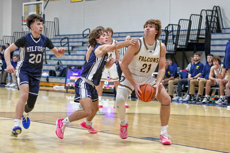 Peyton Larrabee prepares to attempt a layup during Bow’s 15-point victory over Milford at Bow High School on Friday night.