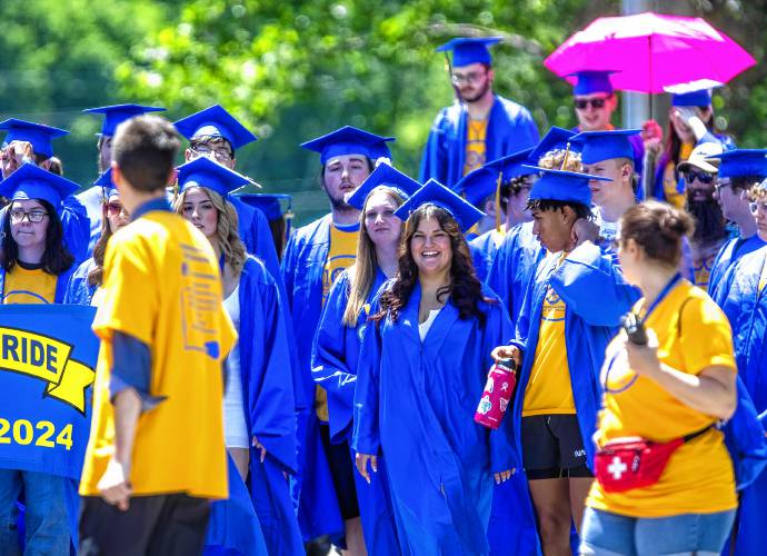 Franklin High School graduates parade down Main Street in Franklin on Thursday, June 13, 2024.
