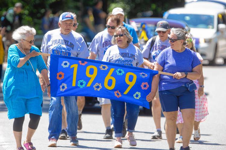 Franklin High School graduates from 1969 walk down Main Street on Thursday.