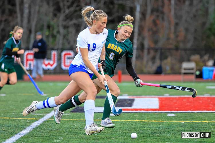 Gilford senior midfielder Olivia Keenan (19) dribbles past Bishop Brady senior midfielder Camdyn Despres (6). Keenan scored a goal for the Golden Eagles in the championship win over the Giants, 2-0.