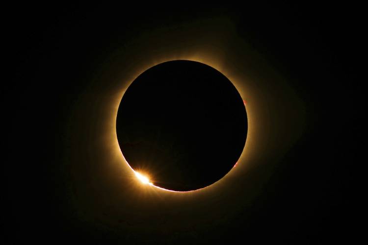 The moon passes in front of the sun for a total solar eclipse visible from Farmington, Mo. on Monday, Aug. 21, 2017 in Farmington, Mo. 