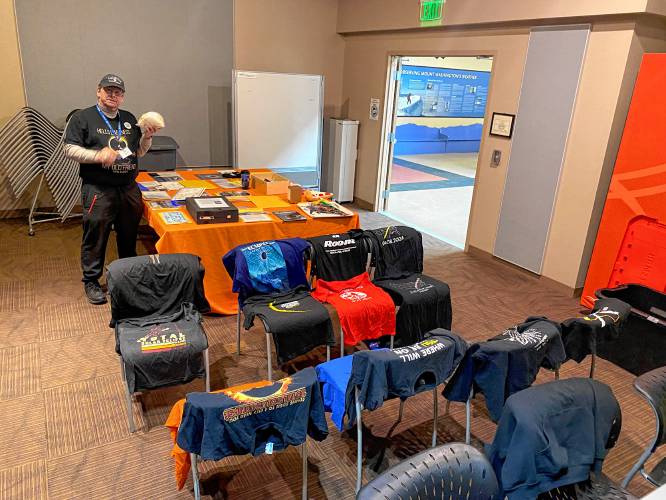 Rik Yeames prepares items to be placed in a time capsule honoring the 2024 solar eclipse, buried behind the McAuliffe-Shepard Discovery Center. May 1, 2024.