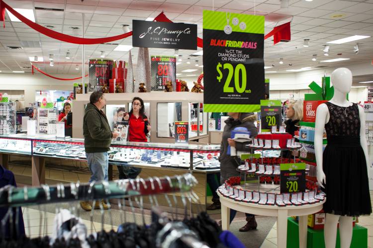 Chipper Hemphill stops by the jewelry counter and receives help from employee Sarah Hashem before continuing his shopping at JCPenney in Concord on Thanksgiving, Nov. 23, 2017. (ELIZABETH FRANTZ / Monitor staff)