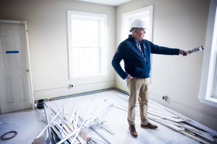 Allen Aldenberg, chief military and veterans service officer for Easterseals of NH and Vermont, looks over  a new apartment in the new facility on April 8.