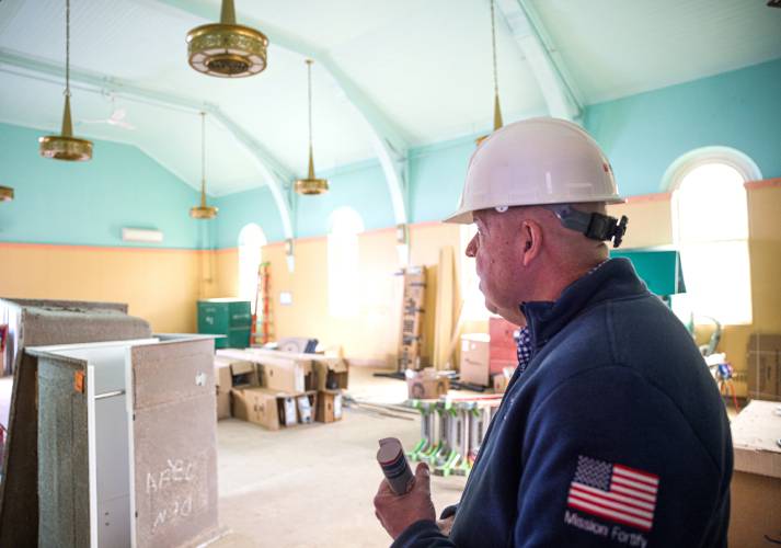 Allen Aldenberg, chief military and veterans service officer for Easterseals of New Hampshire and Vermont, looks over the former chapel of the nunnery that will be a conference room in the new facility on April 8.