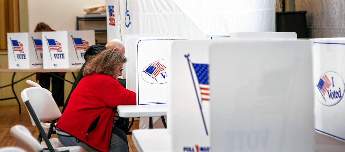 Gail Henry votes inside the Salisbury Town Hall on Tuesday, March 11, 2025.