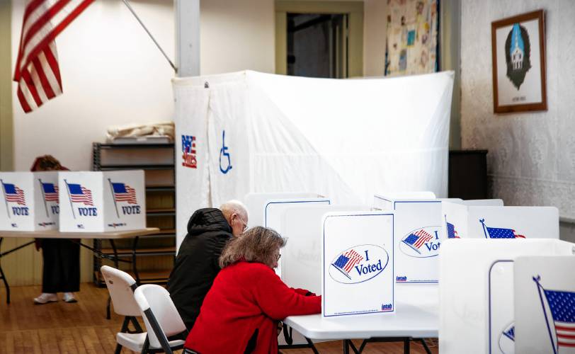 Gail Henry votes inside the Salisbury Town Hall on Tuesday, March 11, 2025.